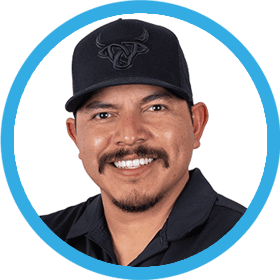 A headshot of a man in a black shirt