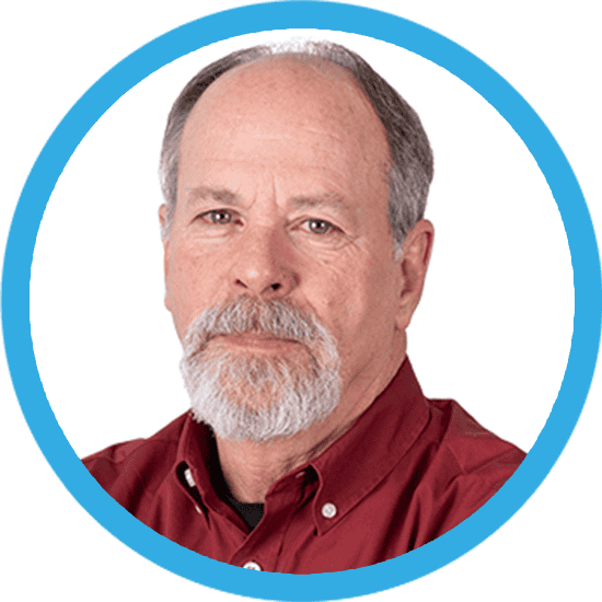 A headshot of a man in a red shirt